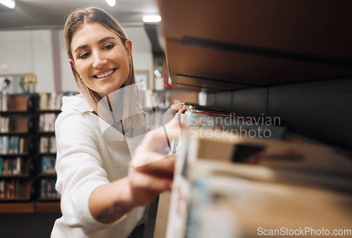 Image of Library books, student and woman packing textbook in a education, university and learning book shop. School, college and happy graduate looking for knowledge, studying and learning with a smile