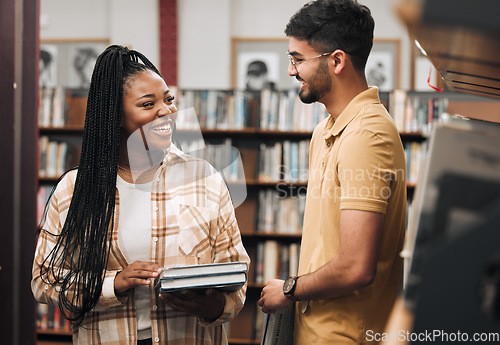 Image of Books, library and couple of friends with study communication, research and project collaboration for idea, goals and learning. Nerd, diversity students by bookshelf for college, university or campus