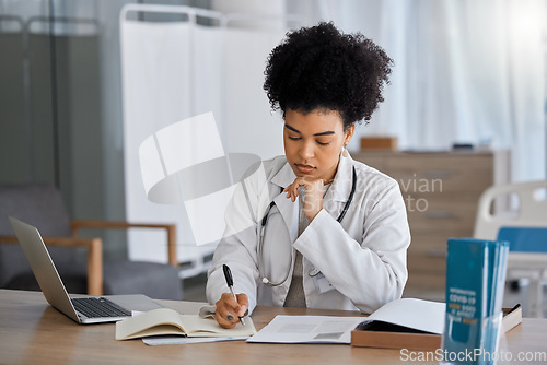 Image of Black woman, doctor and writing in office for results, planning or prescription with focus for wellness. African woman, medical expert and notebook for healthcare, thinking and idea at hospital desk