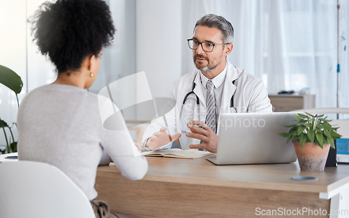 Image of Healthcare, consultation and doctor talking to woman in after checkup, medical appointment and diagnosis. Wellness, support and medical worker in discussion with female patient in hospital or clinic