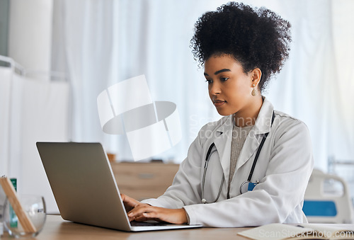 Image of Doctor, laptop and research in office for healthcare, medicine and cancer surgery preparation, serious and focus. Black woman, health expert and online, internet and search for medical innovation