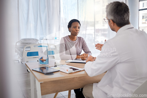 Image of Healthcare, doctor and woman consulting for insurance, help and paperwork in consultation room. Health expert, black woman and discussion with documents for compliance before surgery in a hospital