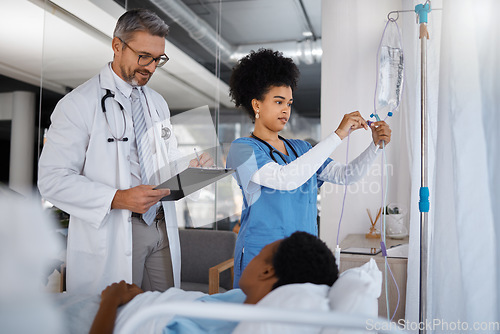 Image of Doctor, nurse and patient in hospital, bed and clinic to check healthcare management, treatment and surgery. Surgeon writing medical notes, results and consulting nursing staff for iv drip medicine