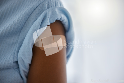 Image of Covid, vaccine and plaster on the arm of a patient in a hospital after a booster shot for cure or treatment. Compliance, corona virus and healthcare with a person in a clinic for security regulations