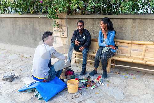 Image of young Ethiopians with shoe polisher on the street, Mekelle, Tigray, Ethiopia