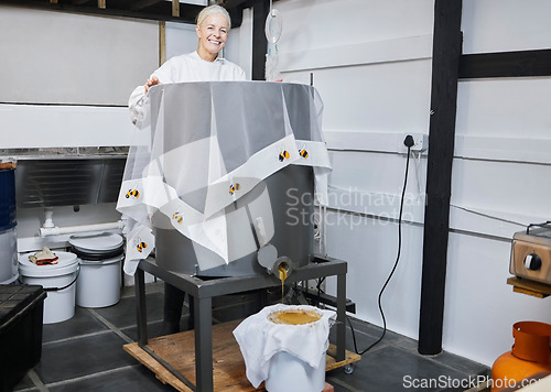 Image of Beekeeping, honey production and woman with a machine for warehouse working, sustainable work and management of process. Happy, agriculture and portrait of a beekeeper with sweet food in storage