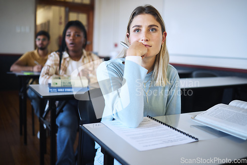 Image of University woman, education class and lecture listening with a student ready to take notes for exam. Learning, studying and classroom working of students in college hearing school test information