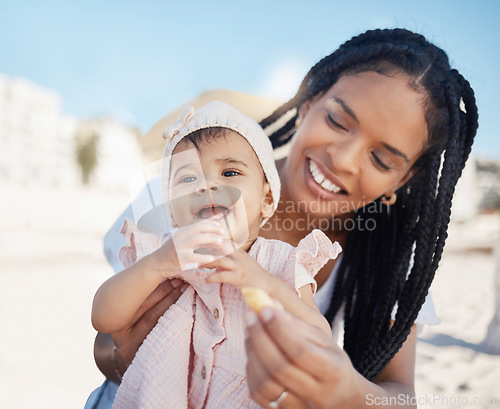 Image of Food, mother and baby at a beach as a happy family on a fun picnic bonding, relaxing or eating on holiday in Brazil. Smile, mama and newborn child enjoys quality time at seashore on summer vacation