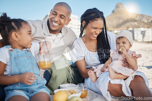 Image of Black family, happy and food picnic on beach with kids to enjoy summer outing together in Cape Town, South Africa. Children, mother and dad relax on sand in nature for bonding in sunshine.