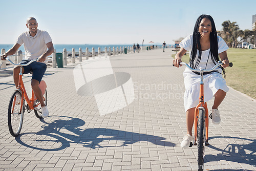 Image of Travel, summer and couple on bike at beach for date on promenade in Chicago, USA sunshine with smile. Freedom, fun and happy black people at ocean with bicycle for wellness, bonding and fitness.