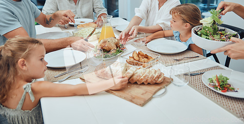 Image of Big family, food and lunch at table in home, eating and bonding. Fine dining, bread and father, mother and grandparents with girls sharing a delicious, gourmet and healthy meal together in house.