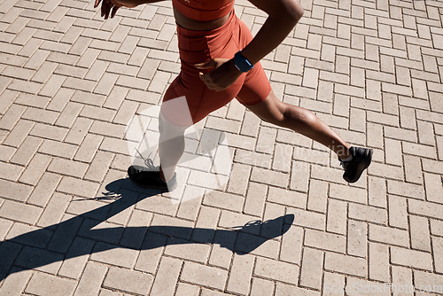 Image of Black woman running for fitness, exercise workout or training for marathon in summer in Nigeria. Legs, girl or fast African sports athlete runner exercising for healthy body wellness with motivation