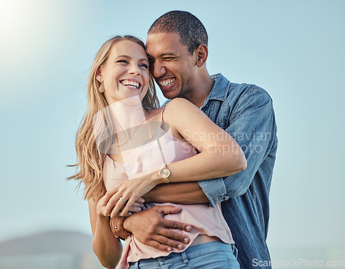 Image of Love, diversity and couple hug on vacation, holiday or summer trip. Romantic, relax smile and happy man and woman hugging, embrace or cuddle, having fun and enjoying quality time together outdoors