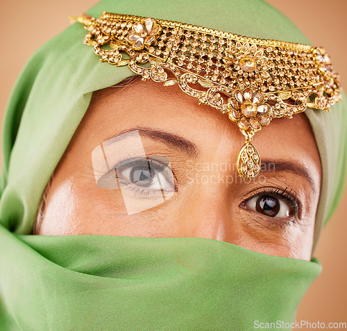 Image of Muslim, woman face and fashion portrait with hijab for islamic beauty, religion jewelry and culture traditional wear. Islam, senior woman and Indian head scarf or burka for arabic headshot in studio