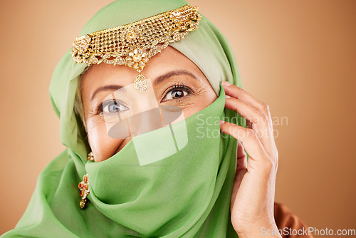 Image of Muslim woman, face or fashion burka on studio background or traditional jewelry, natural makeup cosmetics or religion jewellery. Zoom portrait, happy or mature Islamic model in Dubai aesthetic pride