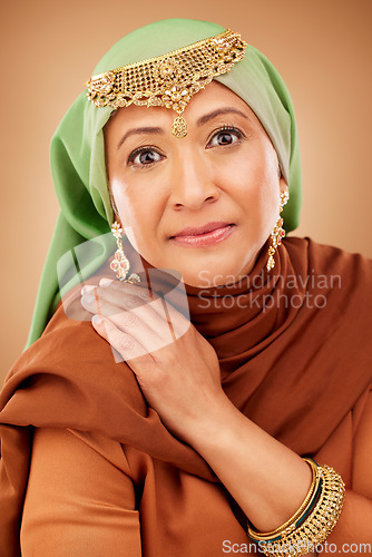 Image of Muslim woman, face or fashion hijab on studio background in religion empowerment, Iranian human rights or Arabic jewelry design. Portrait, mature or Islamic beauty model in scarf or fabric aesthetic