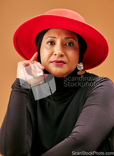 Image of Muslim woman, fashion and hijab for islamic culture style with makeup, cosmetics and beauty of hijabi with a hat on a studio background. Face portrait model of Islam religion with vintage clothes