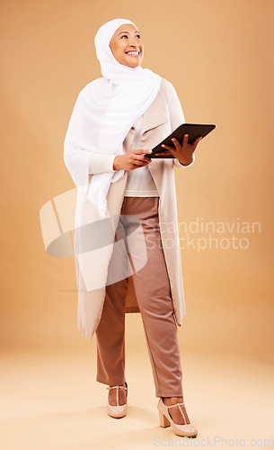 Image of Fashion, muslim and woman with tablet in studio isolated on a brown background mock up. Technology, touchscreen and mature Islamic female thinking of internet browsing, social media or web scrolling.