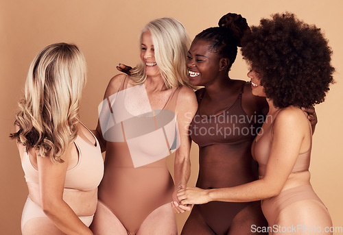 Image of Diversity, beauty and group of women in lingerie in studio isolated on a brown background. Underwear, self love and body positivity, empowerment and confident happy friends with different body types.