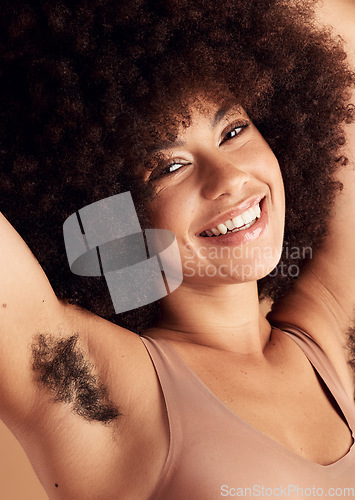 Image of Armpit hair, natural growth and woman satisfied, smile and happy with female body, beauty and wellness. Afro hair, spa salon and headshot face portrait of unshaven African model on studio background
