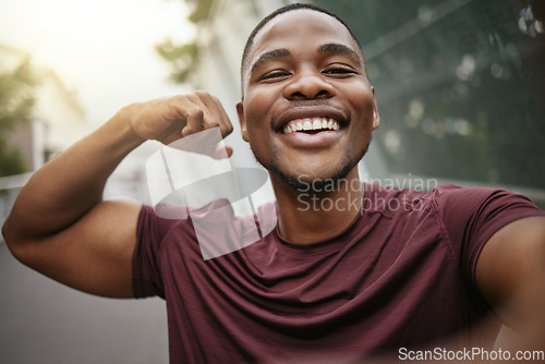 Image of Selfie, smile and fitness arm flex of a black man athlete ready for running, workout and exercise. Training, happy and runner man portrait with motivation for sport, wellness and muscle health