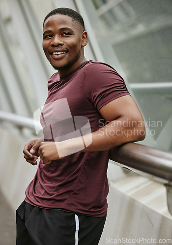 Image of Face, fitness and black man in city or street preparing for training, workout or exercise. Sports, runner and male from Nigeria outdoors in town thinking about jog, exercising or cardio for wellness.