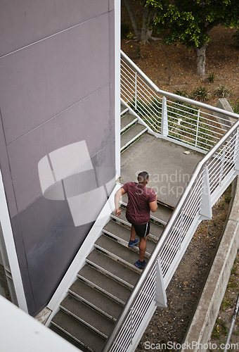 Image of Runner, staircase and outdoor workout for fitness, sports wellness or running exercise. Building stairs, marathon training run in morning and healthy athlete person fon cardio performance motivation