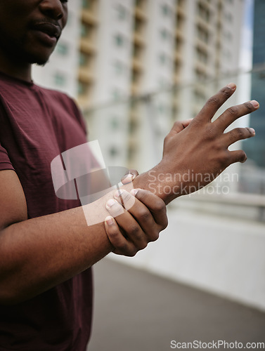 Image of Black man, wrist pain and medical accident outdoor for fitness wellness or exercise workout. Hand emergency, carpal tunnel and African man with arm injury or arthritis for sports training in city