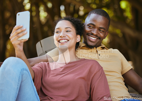 Image of Black couple, phone and selfie with smile at outdoor nature park for travel, happiness and social media profile picture content update. Happy man and woman with 5g network connection on vacation date