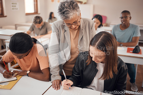 Image of Help, classroom and professor with writing student in learning, mentorship and teaching at university, college or school. Knowledge, language and notes of a teacher with young woman for youth support