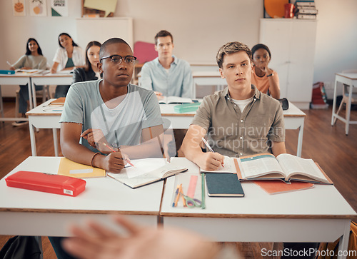 Image of High school, students and boys listening in classroom of education, learning or knowledge. Highschool, studying and attention to teacher, academic lecture and teaching group for young people together
