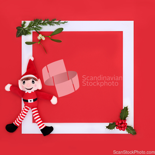 Image of Christmas Eve Elf Toy Background Frame