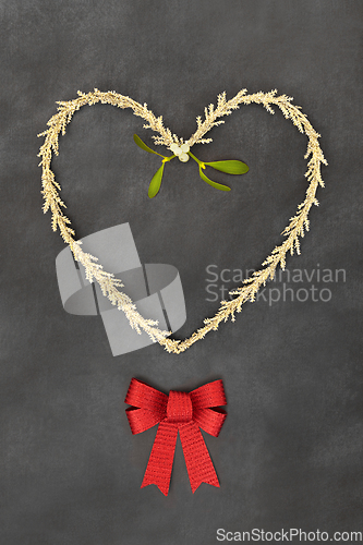 Image of Christmas Symbols Heart Shape Wreath Bow and Mistletoe
