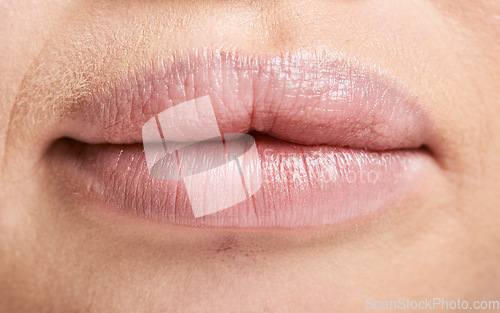 Image of Face, macro and lips of woman with makeup, lipstick and cosmetics. Facial skincare, beauty aesthetics and zoom or extreme closeup of mouth of beautiful albino female with lip filler and healthy skin.