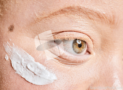 Image of Beauty, albino and woman closeup with sunscreen, product and spf treatment, cosmetics and protection. Skincare, girl and eye, face and facial cream on albinism model for wellness, collagen and skin