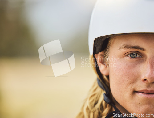 Image of Cycling, mountain biking and half face of a man training for a race, sports competition and fitness in nature of Australia. Moto exercise, biking and portrait of a professional biker and mockup space