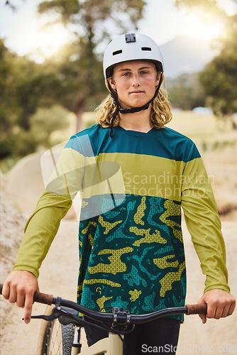 Image of Mountain bike, portrait and man in nature or park for outdoor training, sports competition or fitness goals in Canada with youth lifestyle. Athlete cycling with bicycle and safety helmet for exercise