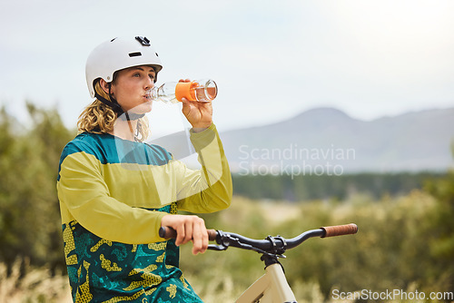Image of Wellness, nature and bike man drinking water for healthy lifestyle and fitness in Vancouver, Canada. Journey, adventure and cycling person with water bottle for cardio exercise hydration break.
