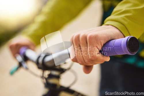 Image of Hands, sports bike and man outdoor getting ready for bmx training, exercise or workout. Cycling, bicycle and male cyclist holding handlebars preparing to ride for adventure, travel or fitness outside
