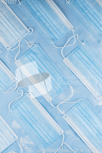 Image of Medical masks on the blue colored background