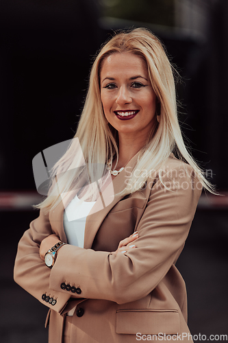 Image of A powerful portrait of a businesswoman, standing confidently with her arms crossed, representing the determination of the female gender and embodying strength and success