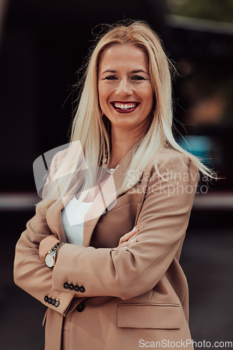 Image of A powerful portrait of a businesswoman, standing confidently with her arms crossed, representing the determination of the female gender and embodying strength and success