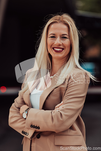 Image of A powerful portrait of a businesswoman, standing confidently with her arms crossed, representing the determination of the female gender and embodying strength and success