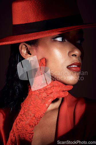 Image of Black woman, fashion and show performance of a model with red lace glove for designer brand. Creative, unique clothes and fashion model wearing retro, vintage power suit and cool aesthetic of girl