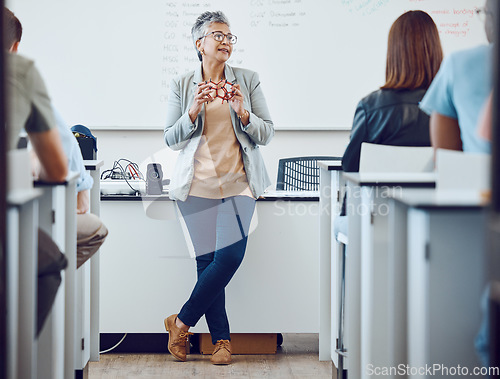 Image of Classroom, presentation and science professor at university of physics or dna model in education, learning and teaching on whiteboard. Students in desk, teacher, leader or presenter woman in college