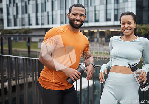 Image of Friends, fitness and workout portrait at bridge for water drink break in city of Chicago, USA. Wellness, exercise and black people on running rest together with hydration, happiness and smile.