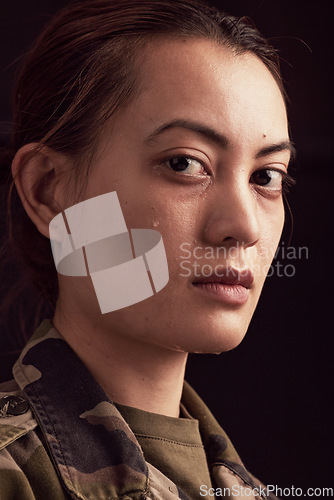 Image of Crying, soldier trauma and face of sad woman with depression, military ptsd and trauma from army service on studio black background. Portrait of depressed young female veteran with tears from battle