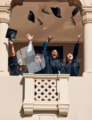 Image of Graduation hat, university and graduate students at celebration ceremony feeling pride. Education friends, smile and excited class with diversity throw graduation cap in sky happy about certificate
