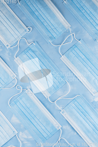 Image of Medical masks on the blue colored background