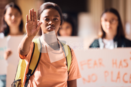 Image of Hand, stop or black woman at a student protest for free public education, government funding or human rights. Girl, school or crowd of angry students fighting for a change, gender equality or justice